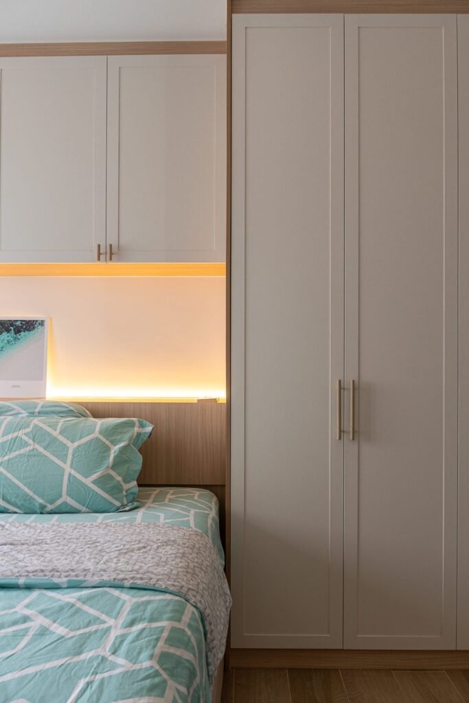 Headboard niche with warm lighting between wardrobes
