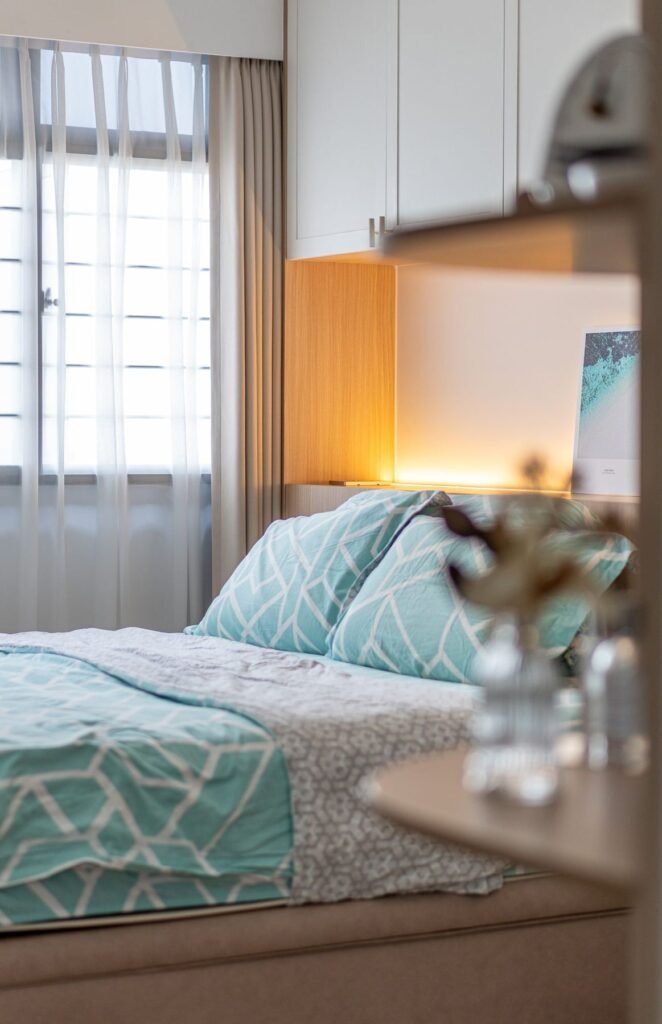 Bed detail with sea-glass blue linens