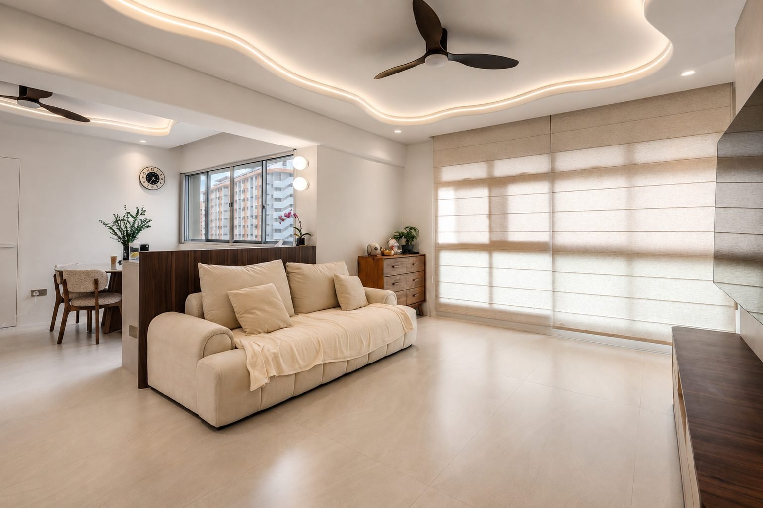 Living room under a cloud-shaped cove ceiling