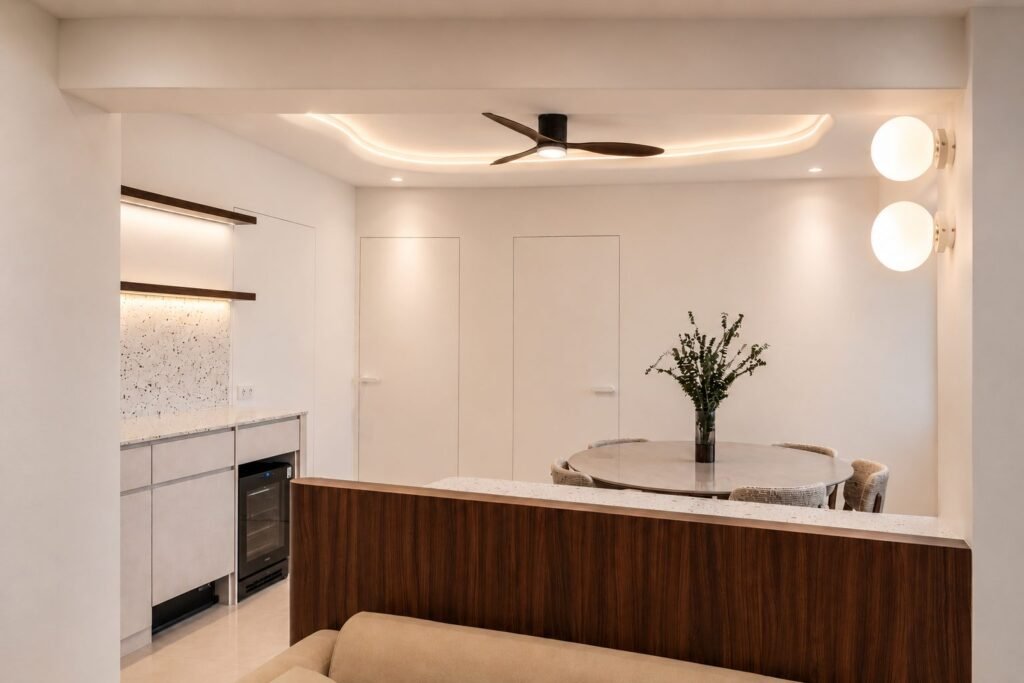 Dining area behind a walnut half-height divider