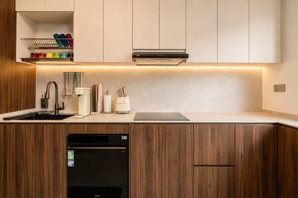 Kitchen with walnut-tone lower cabinets and white upper storage