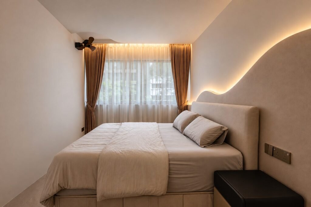 Bedroom with upholstered bed and soft curtains