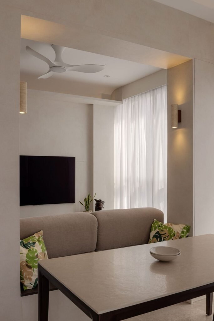 Living room with wall lights and ceiling fan