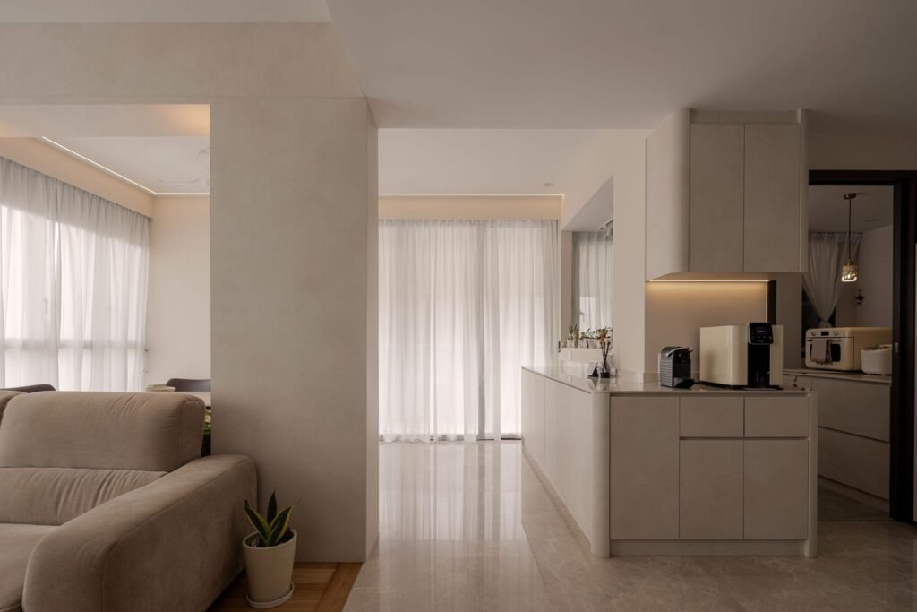Living room opening to the kitchen peninsula