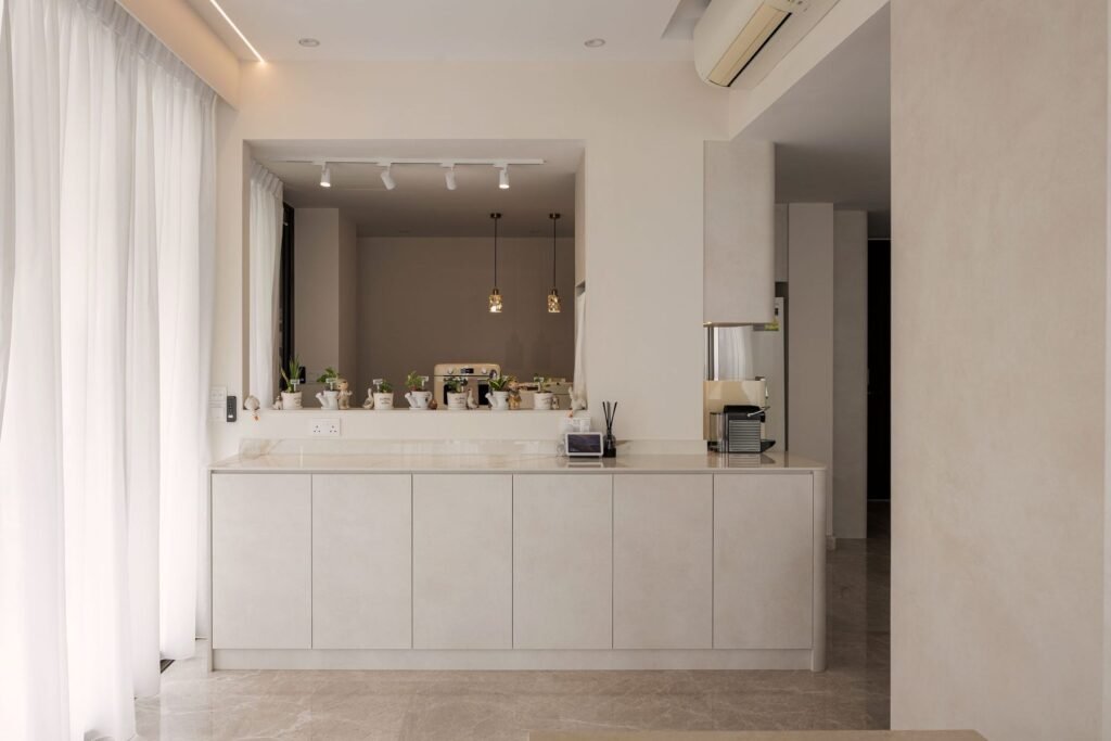 Full-width sideboard with mirror and track lights
