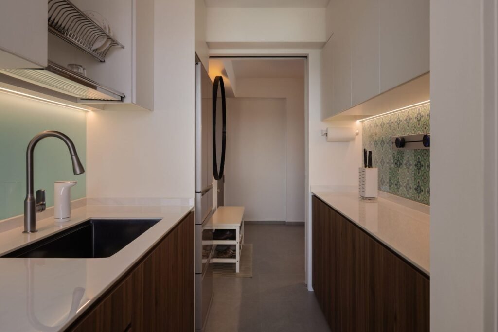 Kitchen with walnut-tone cabinets and white upper storage
