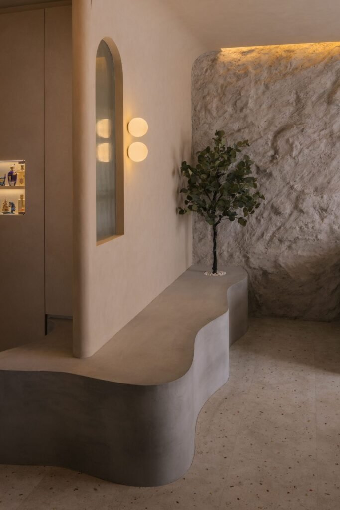 Sculpted curved bench and arched niche at the entrance
