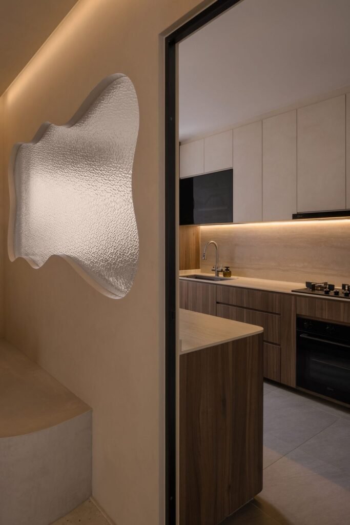 Kitchen seen past a wavy textured-glass panel