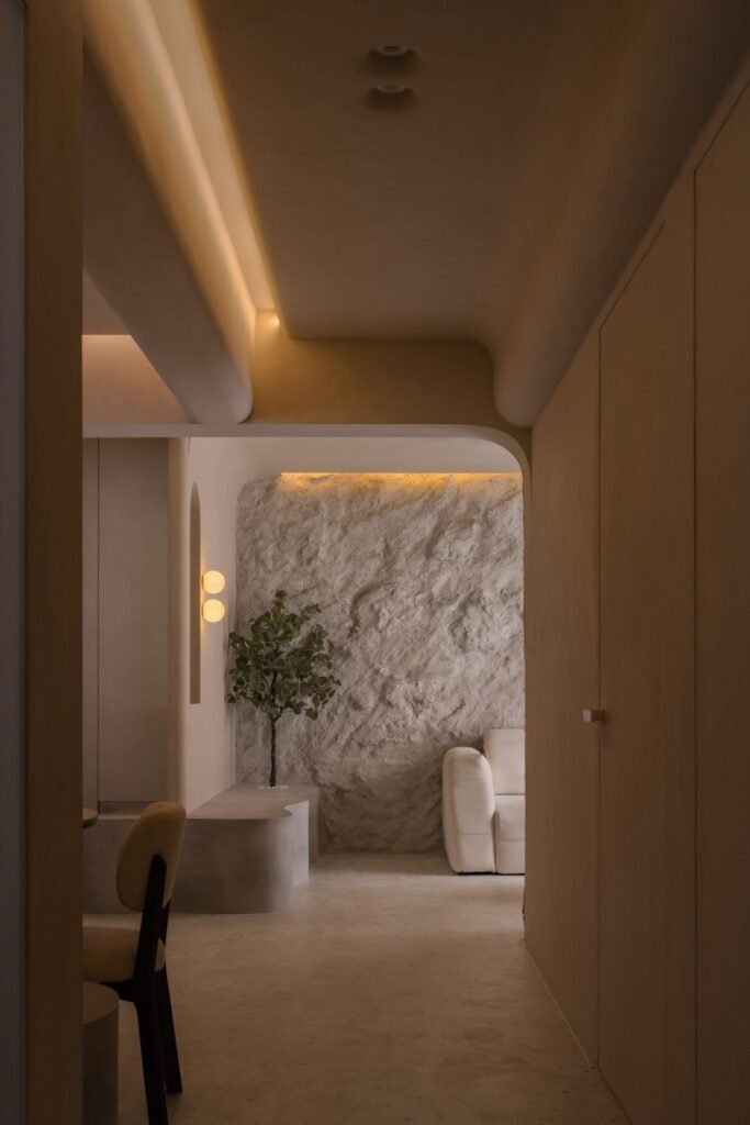 Corridor with concealed doors and cove lighting